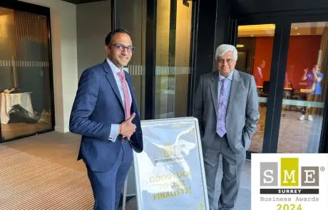 Our founder and managing director next to a SME Surrey Awards sign.